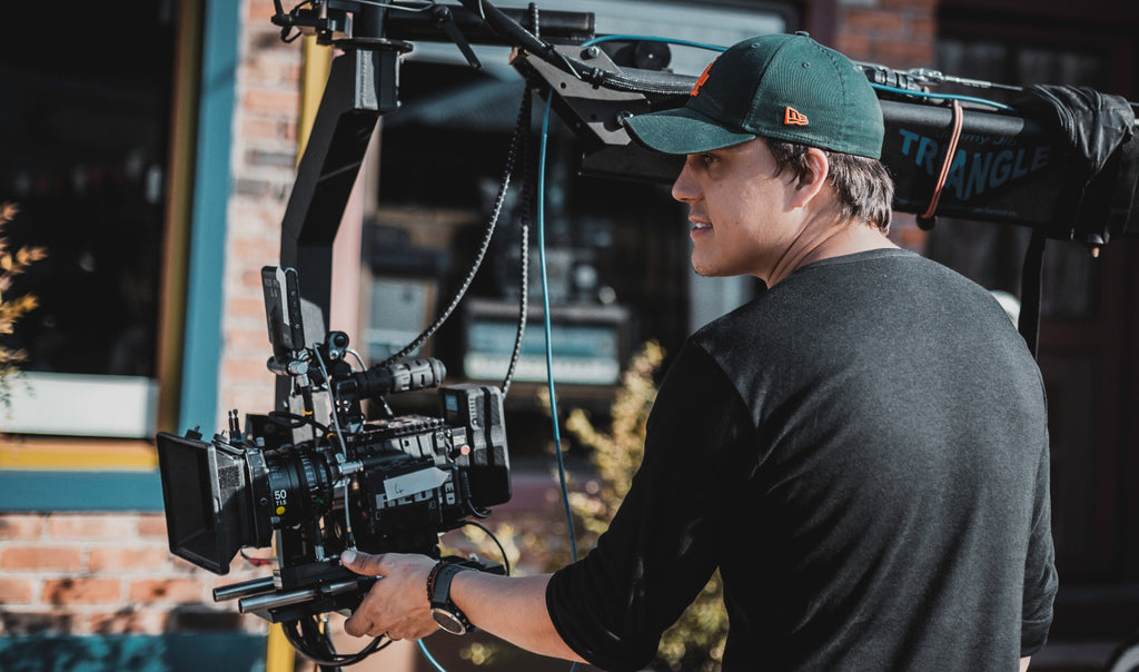 Professional camera operator on a film shoot representing KW PAX filmmaking coaching service