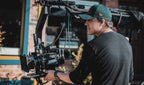 Professional camera operator on a film shoot representing KW PAX filmmaking coaching service