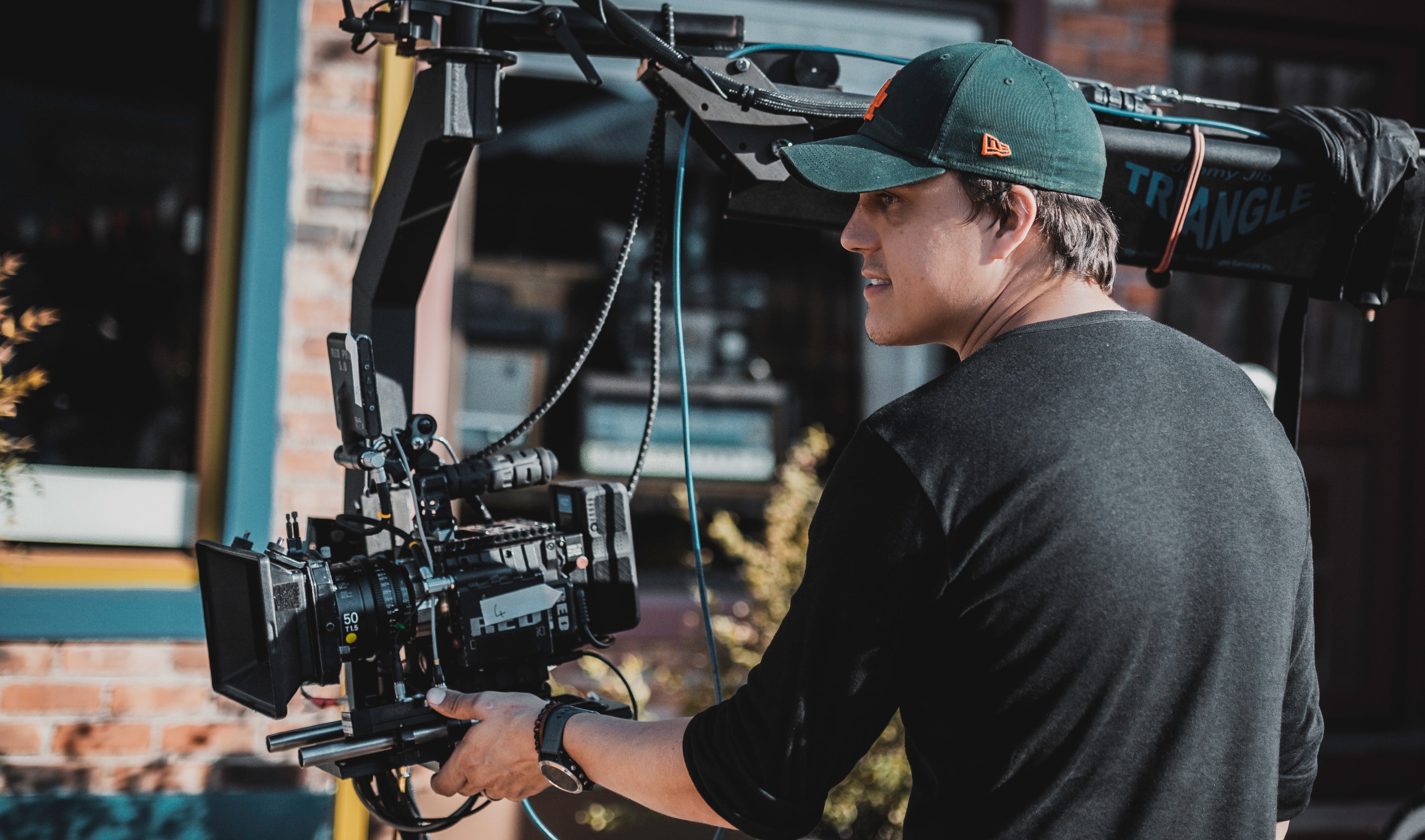 Professional camera operator on a film shoot representing KW PAX filmmaking coaching service