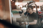 Filmmaker on set during professional production featured in KW PAX coaching session listing